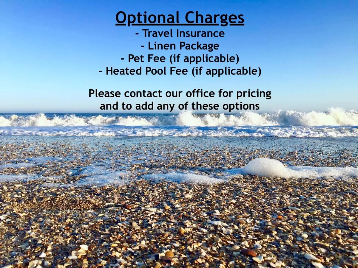 A tranquil stretch of sandy beach is dotted with unique seashells, bordered by gently rolling ocean waves. The shoreline is inviting—perfect for families searching for treasures, building sandcastles, or playing by the water’s edge.